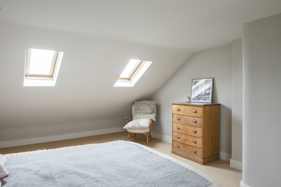 Loft bedroom with skylights.