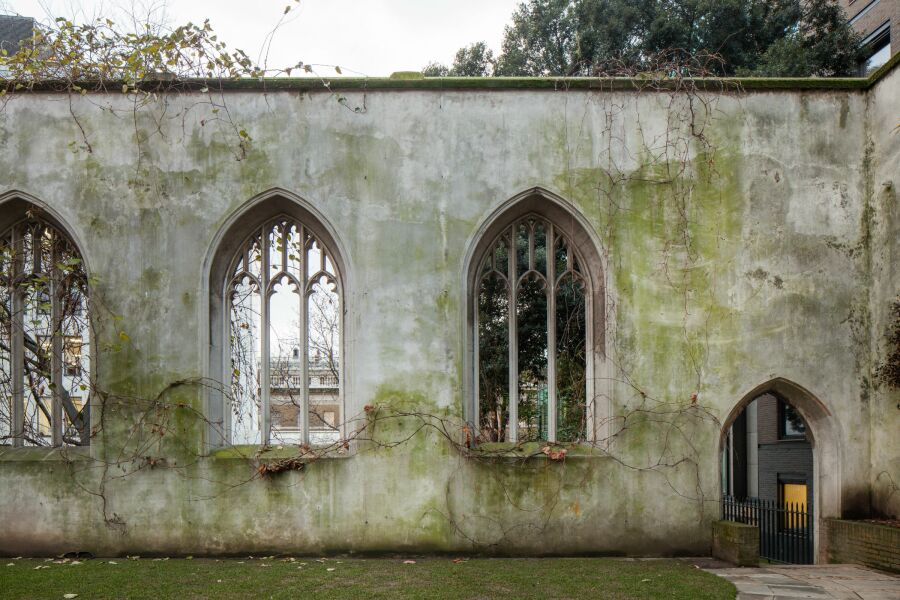 Moss covered masonry walls of St Dunstan's church.